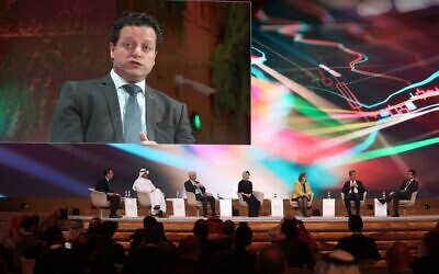 Samer Haj-Yehia (screen), chairman of Israel's Bank Leumi, attends a panel on the third day of the annual Future Investment Initiative (FII) conference in Saudi Arabia's capital Riyadh on October 27, 2022. (Fayez Nureldine/AFP)