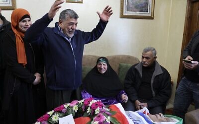 Palestinian relatives mourn during the funeral of Omar As'ad, 78, who was found dead after being detained and handcuffed during an Israeli raid, in Jiljilya village in the West Bank, on January 13, 2022. (Photo by JAAFAR ASHTIYEH / AFP)