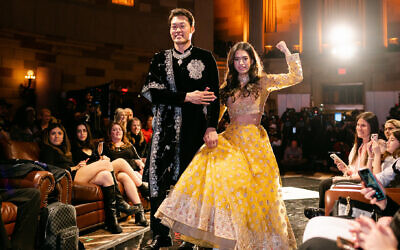 Lily Brasch (right), who has muscular dystrophy, walks the runway at New York Fashion Week for the South Asian brand Randhawa, February 10, 2023. (Hilary Phelps via JTA)