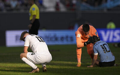 Israeli defender Noam Ben Harosh reacts after Israel's loss to Uruguay in the semifinal of the Argentina 2023 U-20 World Cup, at the Estadio Unico Diego Armando Maradona stadium in La Plata, Argentina, on June 8, 2023. (Juan Mabromata/AFP)