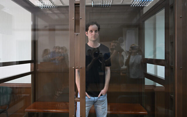 Wall Street Journal reporter Evan Gershkovich stands inside a glass cage before a hearing on his appeal against his extended detention, at the Moscow City Court,  in Moscow on June 22, 2023. (Natalia Kolesnikova/AFP)