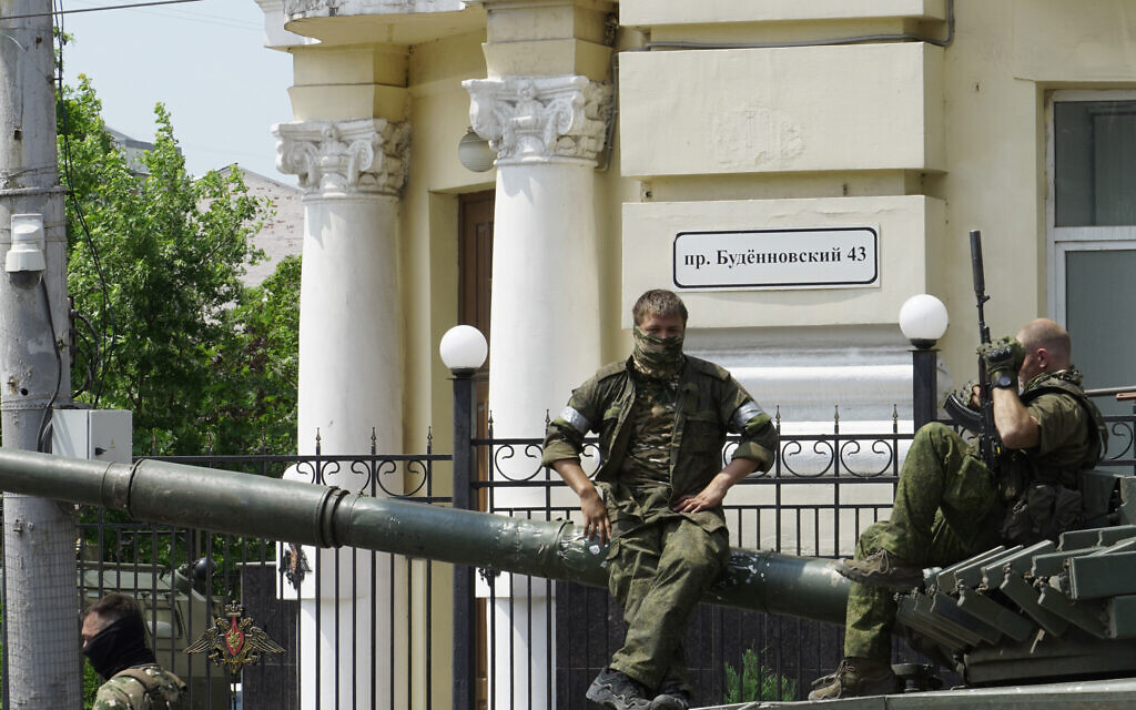 Members of Wagner group sit atop of a tank in a street in the city of Rostov-on-Don, on June 24, 2023. (Stringer/AFP)