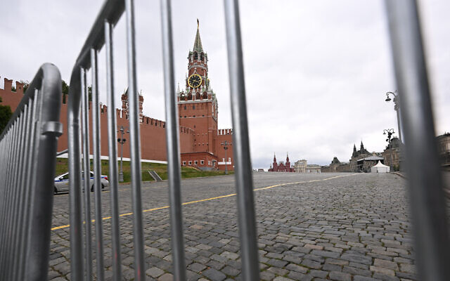 The Spasskaya Tower is seen through metal barriers at Moscow's Red Square on June 24, 2023. (Natalia Kolesnikova/AFP)