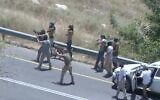 A screenshot from video of settlers firing at the West Bank village of Umm Safa on June 24, 2023. (Twitter video screenshot: Used in accordance with Clause 27a of the Copyright Law)