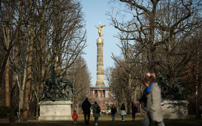 People walk through the Tiergarten Park, in Berlin, Germany, where a new memorial commemorating Jehovah's Witness victims of the Nazis is set to be built, February 25, 2021. (STEFANIE LOOS/AFP)