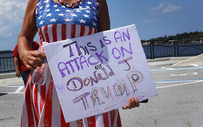 Supporters of former US president Donald Trump gather near his Mar-A-Lago home after he was indicted on a new set of charges related to the mishandling of classified documents, in Palm Beach, Florida, on June 11, 2023. (Scott Olson/Getty Images/AFP)