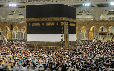 In this photo taken with low shutter speed, Muslim pilgrims circumambulate around the Kaaba, the cubic building at the Grand Mosque, in Mecca, Saudi Arabia, July 6, 2022. (Amr Nabil/AP)