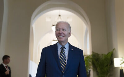 US President Joe Biden smiles as he speaks about Democratic control of the Senate before leaving his hotel to attend the Association of Southeast Asian Nations (ASEAN) summit, November 13, 2022, in Phnom Penh, Cambodia. (AP Photo/Alex Brandon)