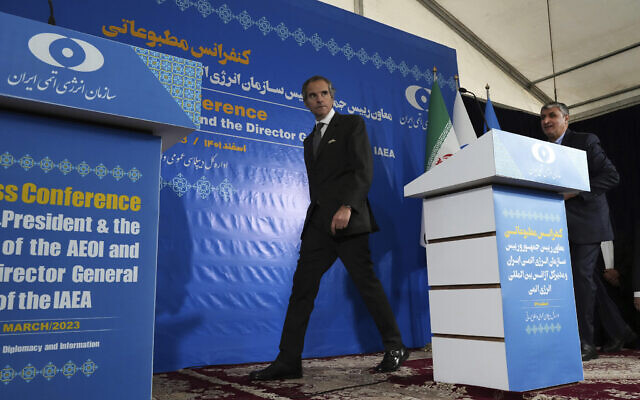 International Atomic Energy Organization, IAEA, Director General Rafael Mariano Grossi, center, and head of Atomic Energy Organization of Iran Mohammad Eslami arrive for a joint press conference  in Tehran, Saturday, March 4, 2023. (AP/Vahid Salemi)