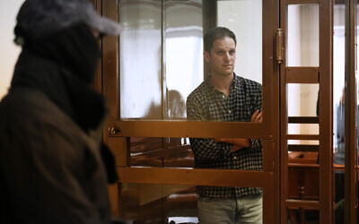 Wall Street Journal reporter Evan Gershkovich stands in a glass cage in a courtroom at the Moscow City Court, in Moscow, Russia, April 18, 2023. (AP/Alexander Zemlianichenko)