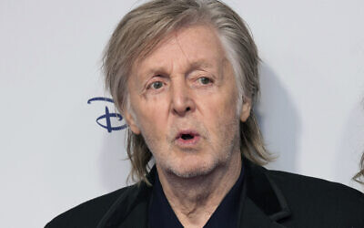 FILE - Paul McCartney poses for photographers upon arrival for the premiere of the film 'If These Walls Could Sing' in London, Monday, Dec. 12, 2022.  (Photo by Scott Garfitt/Invision/AP, File)