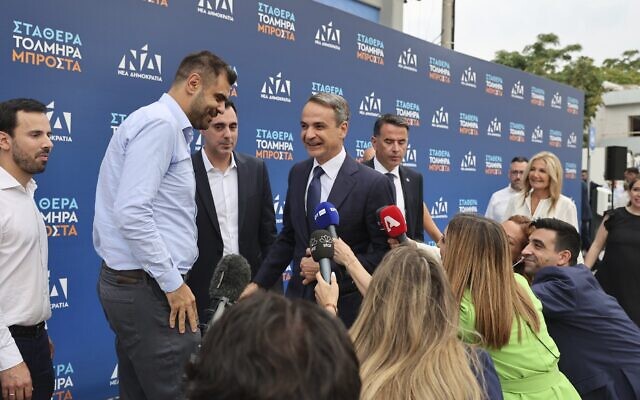 Kyriakos Mitsotakis leader of center-right New Democracy arrives at the headquarters of the party in Athens, Greece, June 25, 2023. (AP Photo/Yorgos Karahalis)