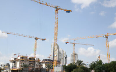 New buildings going up in Beer Yaakov on March 26, 2020. (Flash90)