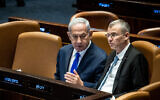 Prime Minister Benjamin Netanyahu (L) with Justice Minister Yariv Levin at the Knesset in Jerusalem, on June 7, 2023. (Oren Ben Hakoon/Flash90)