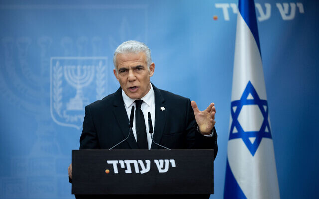 Opposition leader Yair Lapid speaks during a faction meeting at the Knesset on June 19, 2023. (Yonatan Sindel/Flash90)