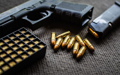 Illustrative: A handgun and bullets. (Somboon Kaeoboonsong; iStock by Getty Images)