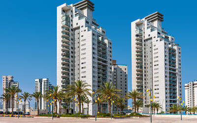 New modern high-rise residential buildings under a blue sky in city of Ashdod, Israel. July 2021. (rglinsky via iStock by Getty Images)