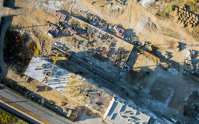 An aerial view of a construction site in Israel where a residential building is being built, October 2021. Illustrative. (photovs via iStock by Getty Images)