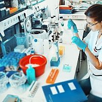 Illustrative image of a scientist in a lab (anyaivanova; iStock by Getty Images)