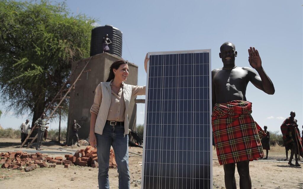 Innovation Africa founder & CEO Sivan Yaari bringing solar panels to an African village in Karamoja, Uganda. (Courtesy)