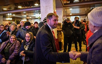 Moldova's parliamentary candidate Ilan Shor, leader of his self-named party, meets with supporters during a campaign event in the city of Comrat on February 15, 2019. (Daniel Mihailescu/AFP)