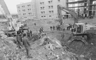 Rescue workers search for survivors after an explosion at Israeli military headquarters in the Lebanese city of Tyre in 1982. (Wikimedia Commons/IDF Archive)