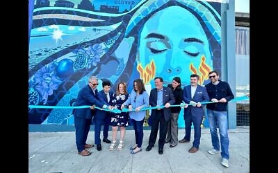 Los Angeles leaders cut the ribbon for the unveiling of a new mural in the Pico-Robertson neighborhood. (Pictured from left to right: Ilan Davidson, President of LA County Commission on Human Relations; Robin Toma, executive director of LA County Commission on Human Relations; Supervisor Lindsey Horvath; Councilwoman Katy Yaroslavsky; Jeff Abrams, ADL Los Angeles regional director; Rabbi Rebecca Schatz, Temple Beth Am; Rabbi Noah Farkas, President and CEO of The Jewish Federation of Greater Los Angeles; Senator Ben Allen. Image courtesy of the Jewish Federation of Greater Los Angeles)