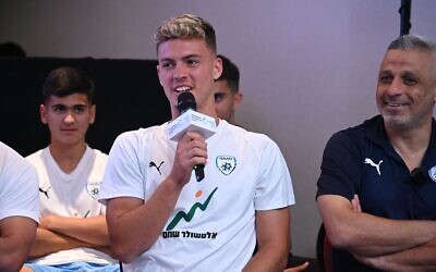 El Yam Kancepolsky speaks at a welcome event for the Israeli team in Buenos Aires, May 15, 2023. Team manager Ofir Haim is on right. (Leonardo Kremenchuzky/World Zionist Organization via JTA)