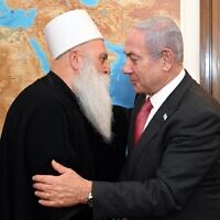 Prime Minister Benjamin Netanyahu meets with Druze spiritual leader Sheikh Moafaq Tarif in his office in Jerusalem on June 21, 2023. (Haim Zach/GPO)