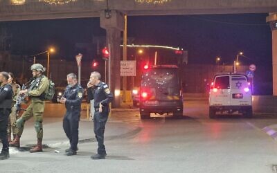 Police at the scene of a shooting attack at the Qalandiya checkpoint, north of Jerusalem, early June 24, 2023. (Israel Police)