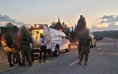 Medics attend to an IDF soldier wounded in an alleged car-ramming attack in the northern West Bank, June 19, 2023. (Magen David Adom)